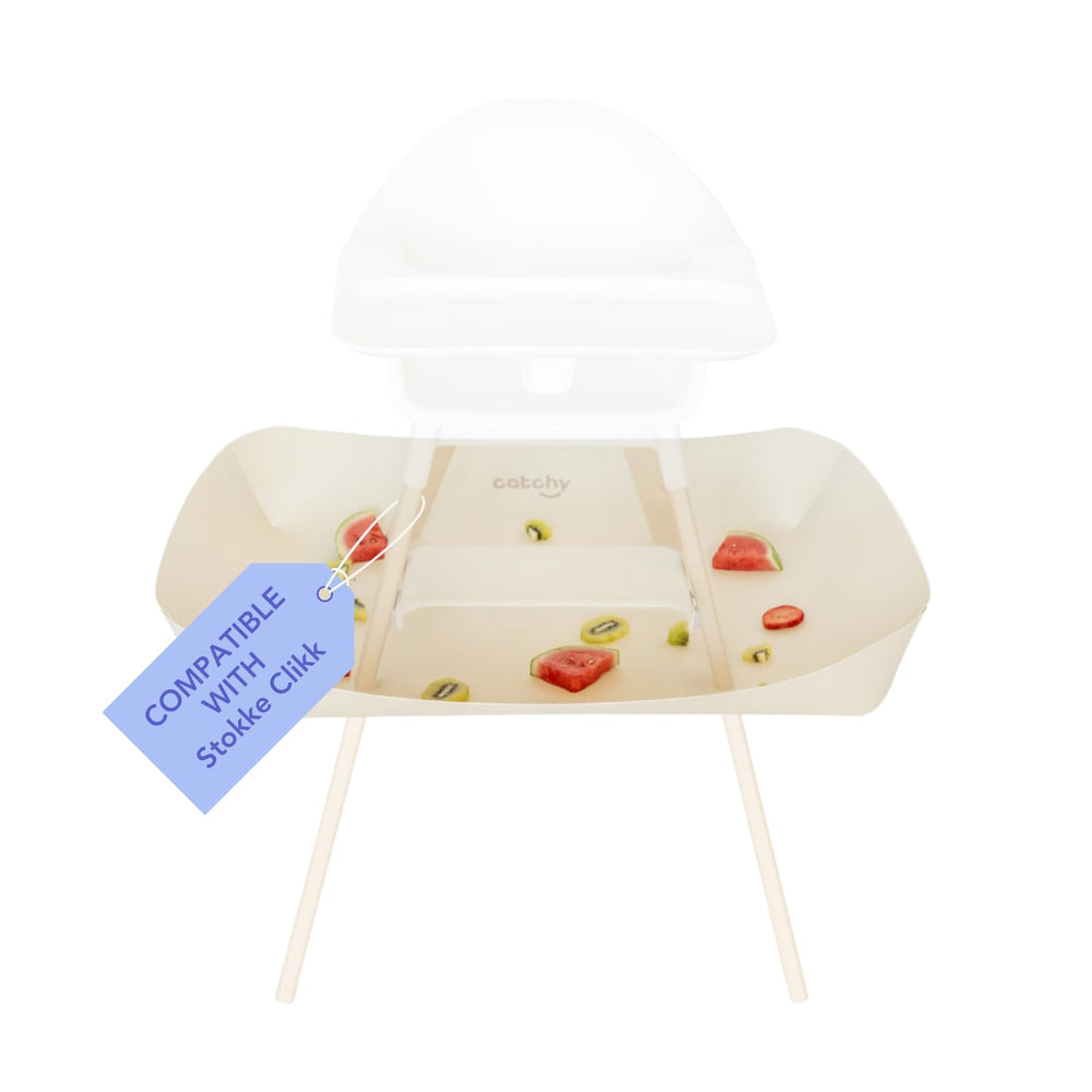 Catchy Food Catcher attached to Stokke Clikk highlights compatibility and mess containment.
