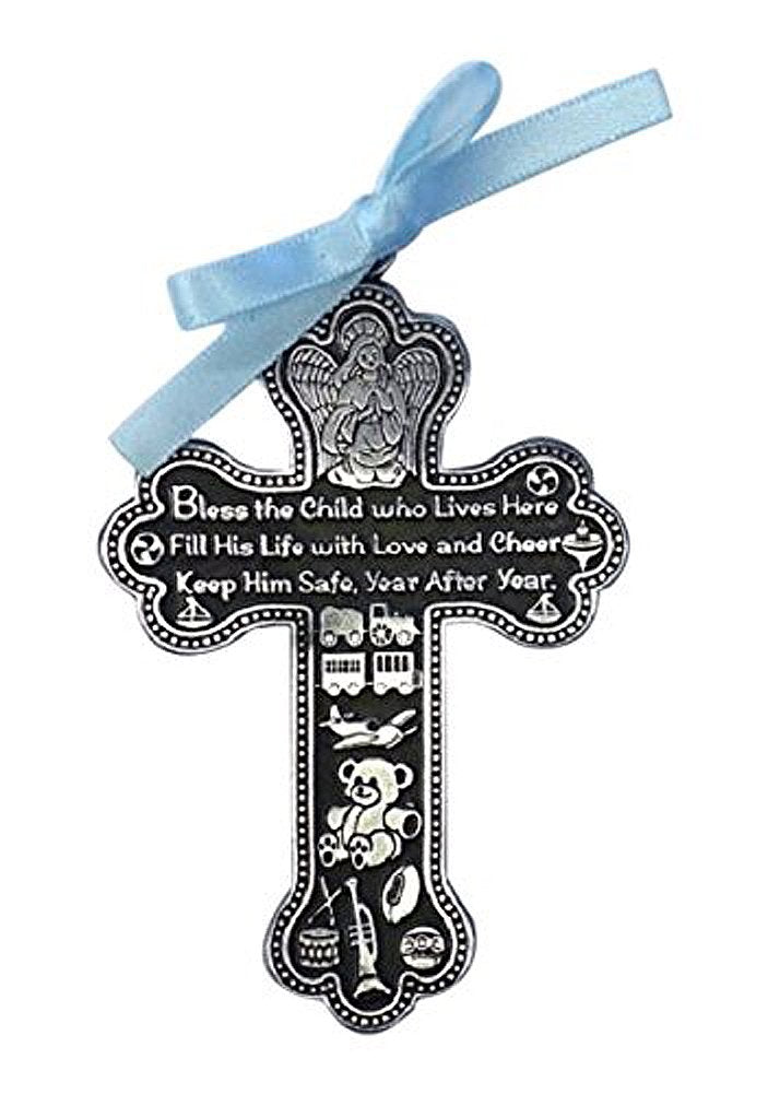 Cathedral Art Baby Boy Cross Crib Medal with blue ribbon beside the crib for nightly blessing.