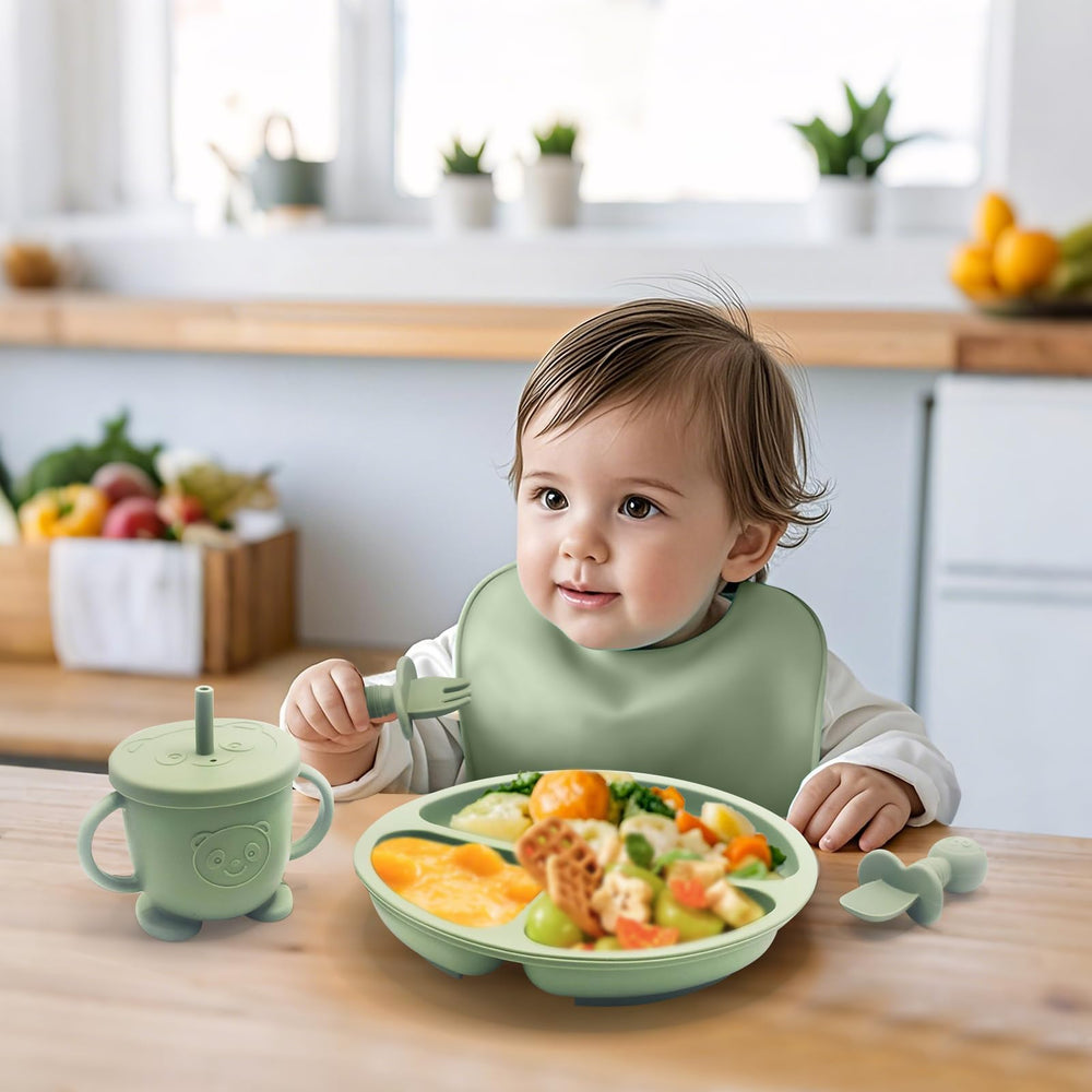 Catvegue green silicone utensils offer soft grips for small hands.