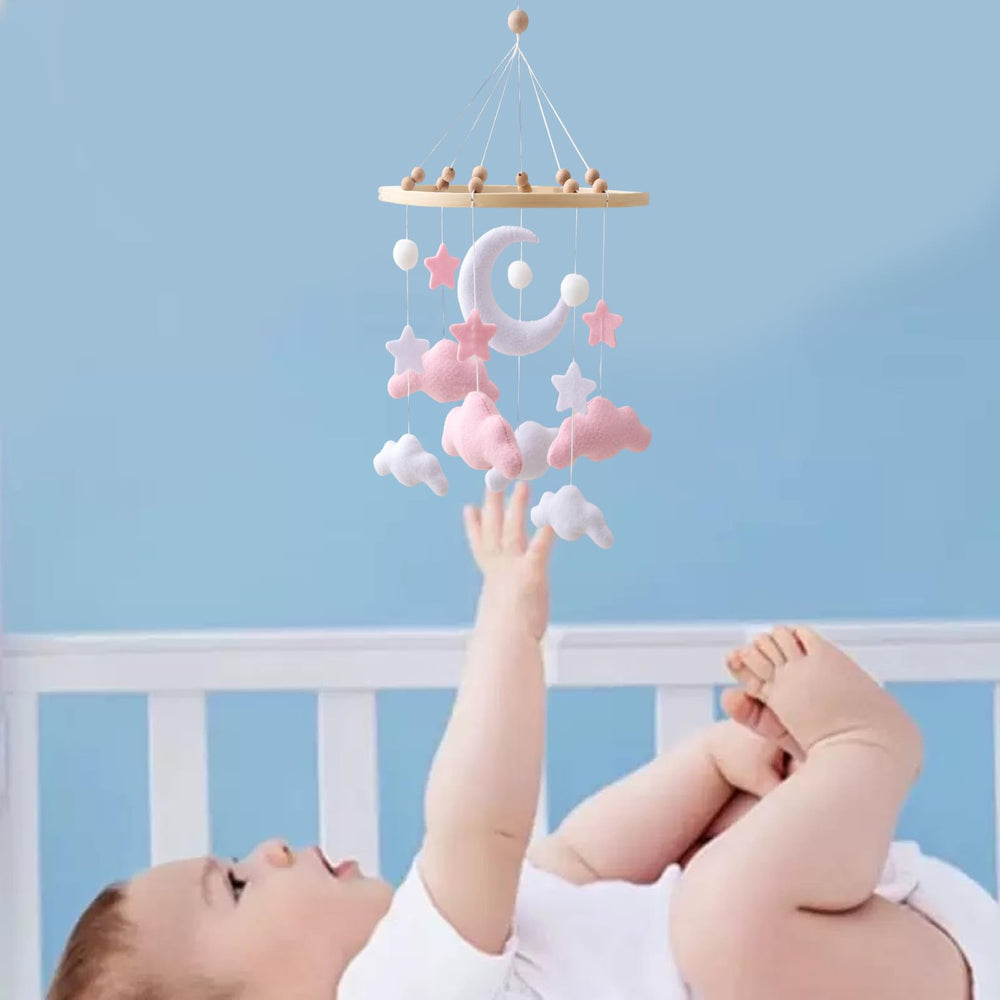 Ceecolia soft felt stars mobile promotes calm ambiance in nursery.