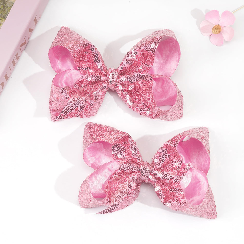 CellElection pink bow clip ideal for birthdays and dress-up moments