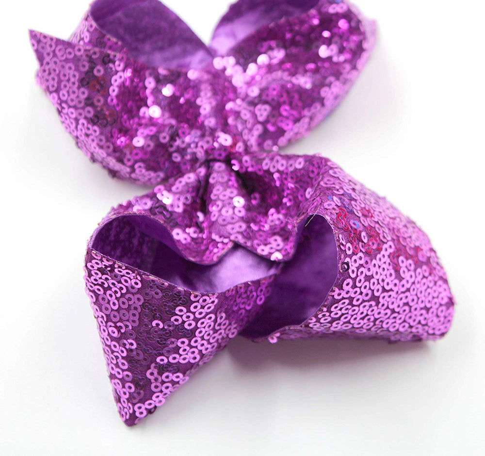 CellElection white sequin bow with clip enhances cute, coordinated looks