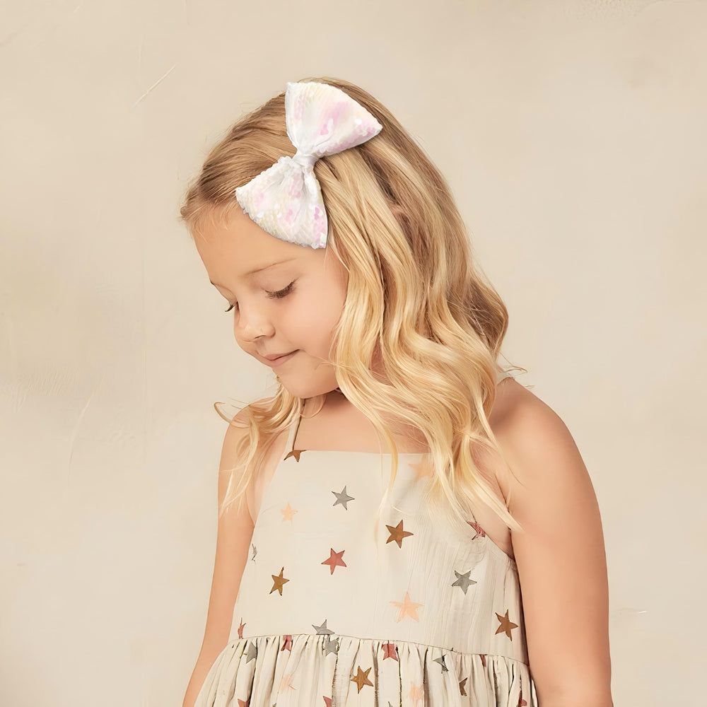 CÉLLOT white sequin bow adds sparkle to weddings, holidays, and family photos.