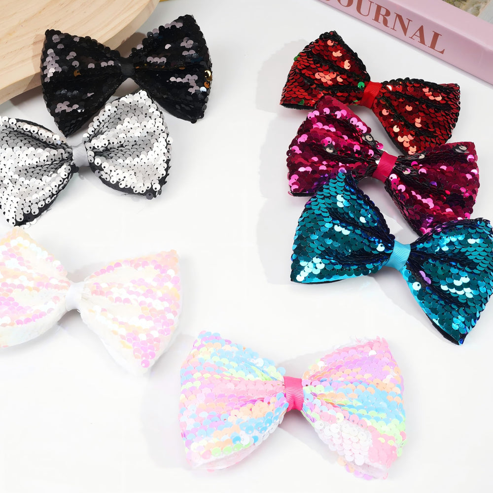 CÉLLOT party bow accessory for ponytails, buns, and half-up styles.