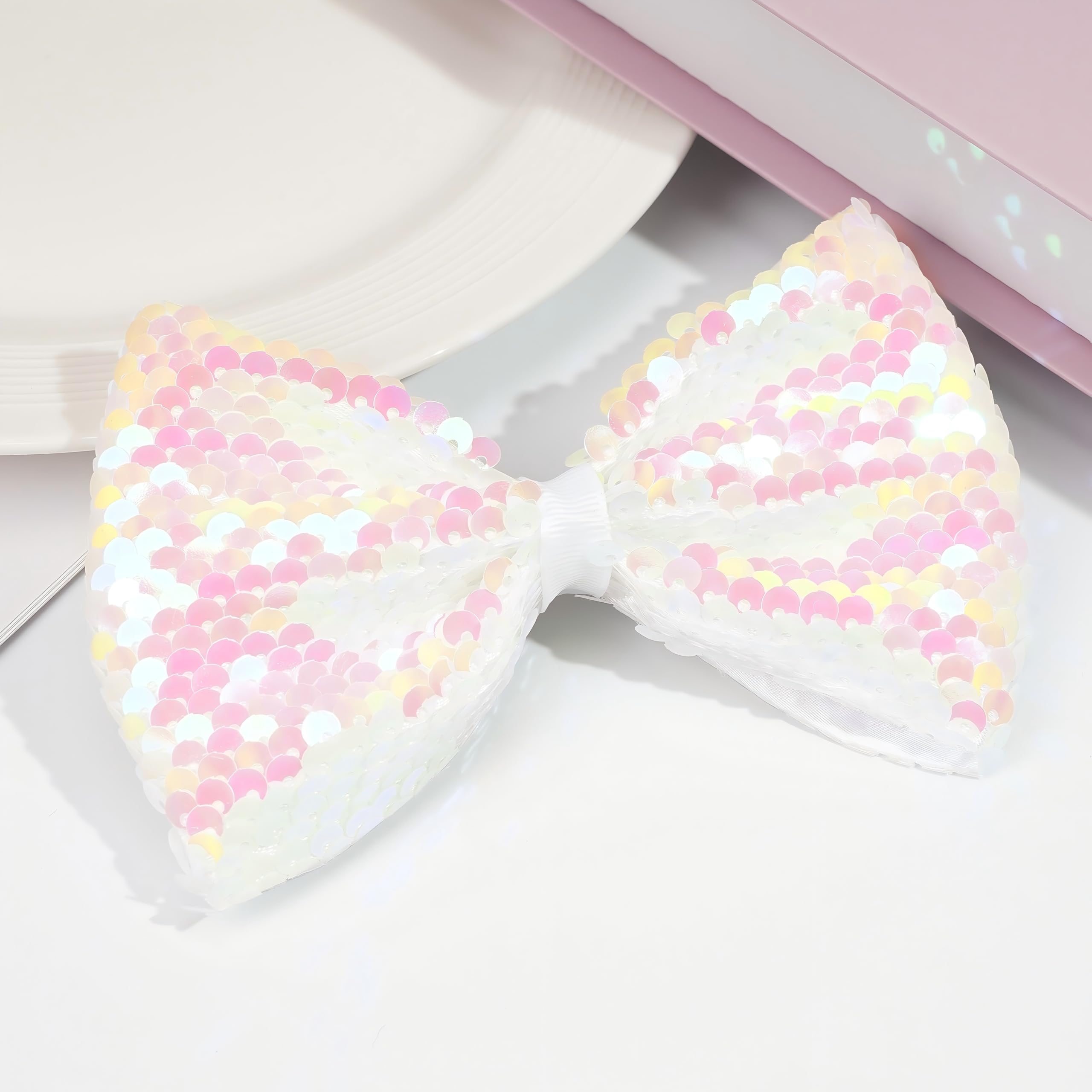 CÉLLOT sequin bow on crocodile clip brightens every outfit from casual to party.