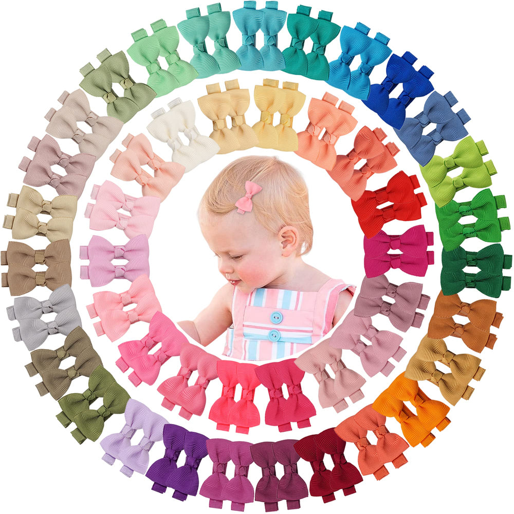 CÉLLOT baby bows close-up on clips showing velvet inner grip keeps hair in place.