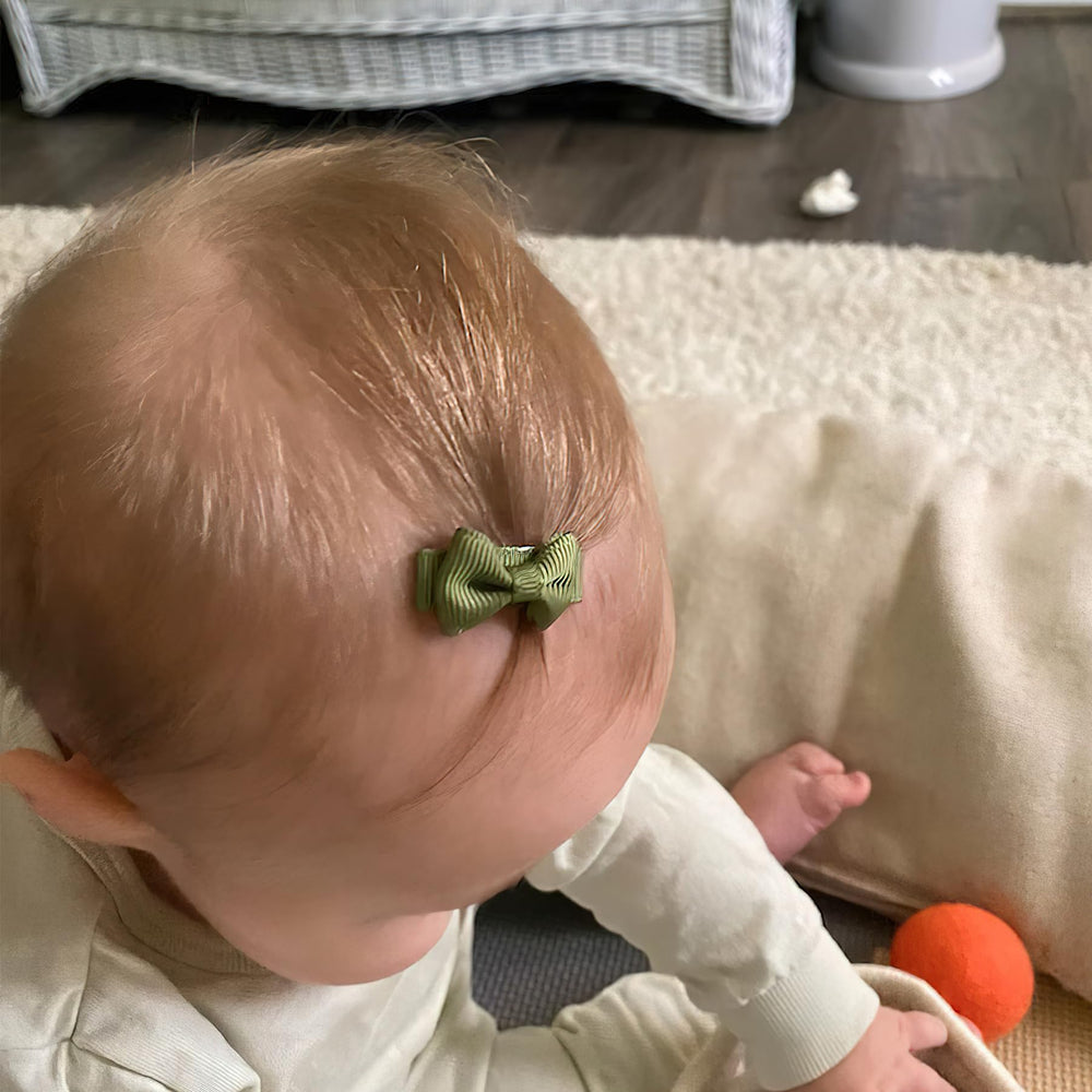 Cellot dainty baby bows in matching pairs for outfits.