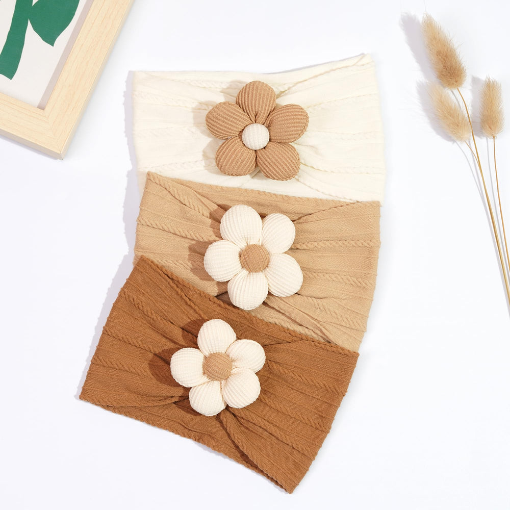 CÉLLOT daisy flower design headbands add charming detail