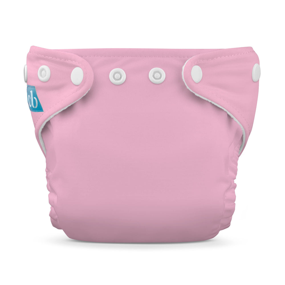 Charlie Banana cloth diaper in baby pink color, gentle for newborn skin and reusable.