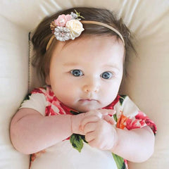 Cherrboll baby flower headband cream — odorless nylon and gentle stretch for newborns through toddlers.