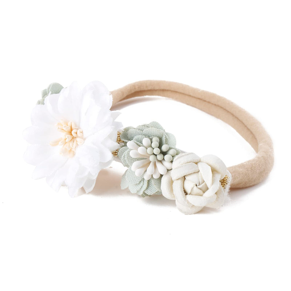 Cherrboll flower headbands styled for birthday parties and photoshoots.