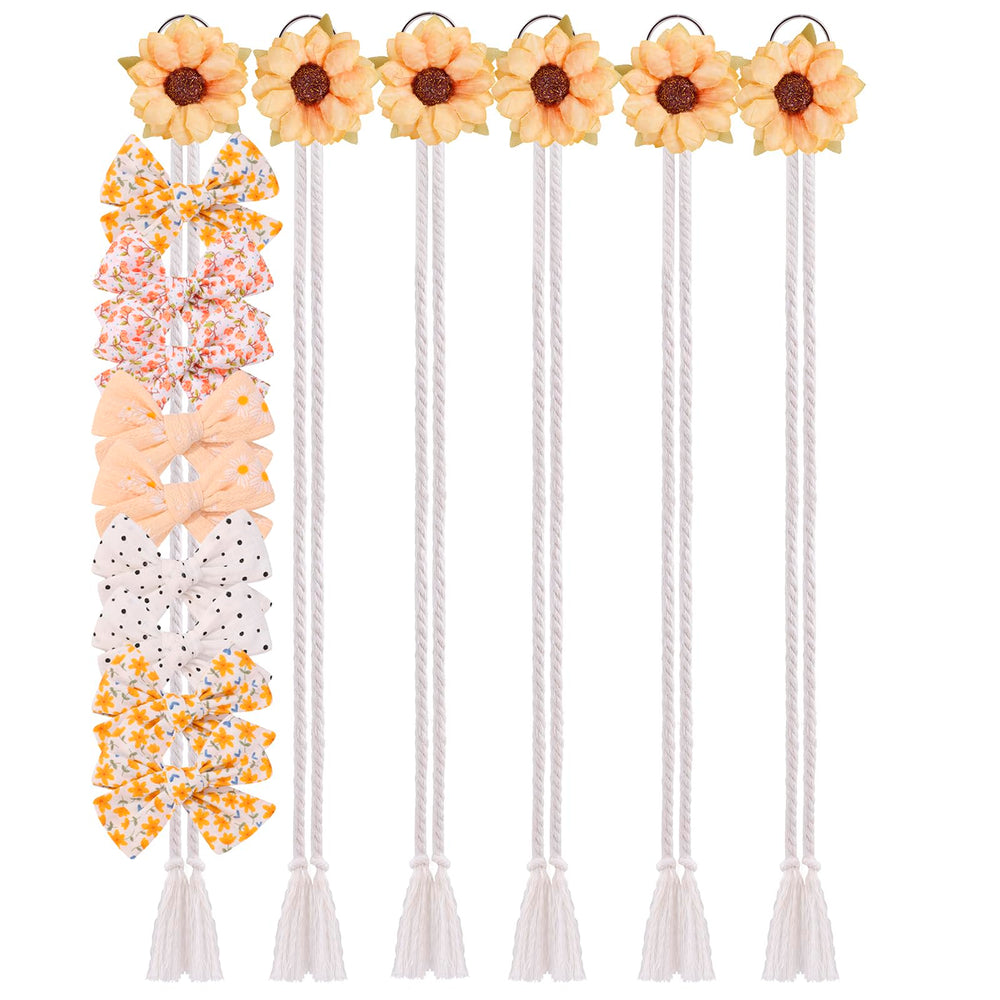 Cherrboll floral bow organizer on wall keeps bows tidy and visible.