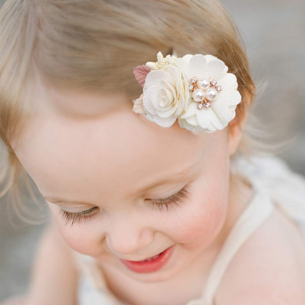 Cherrboll flower clip closeup reveals handcrafted fabric and pearl details
