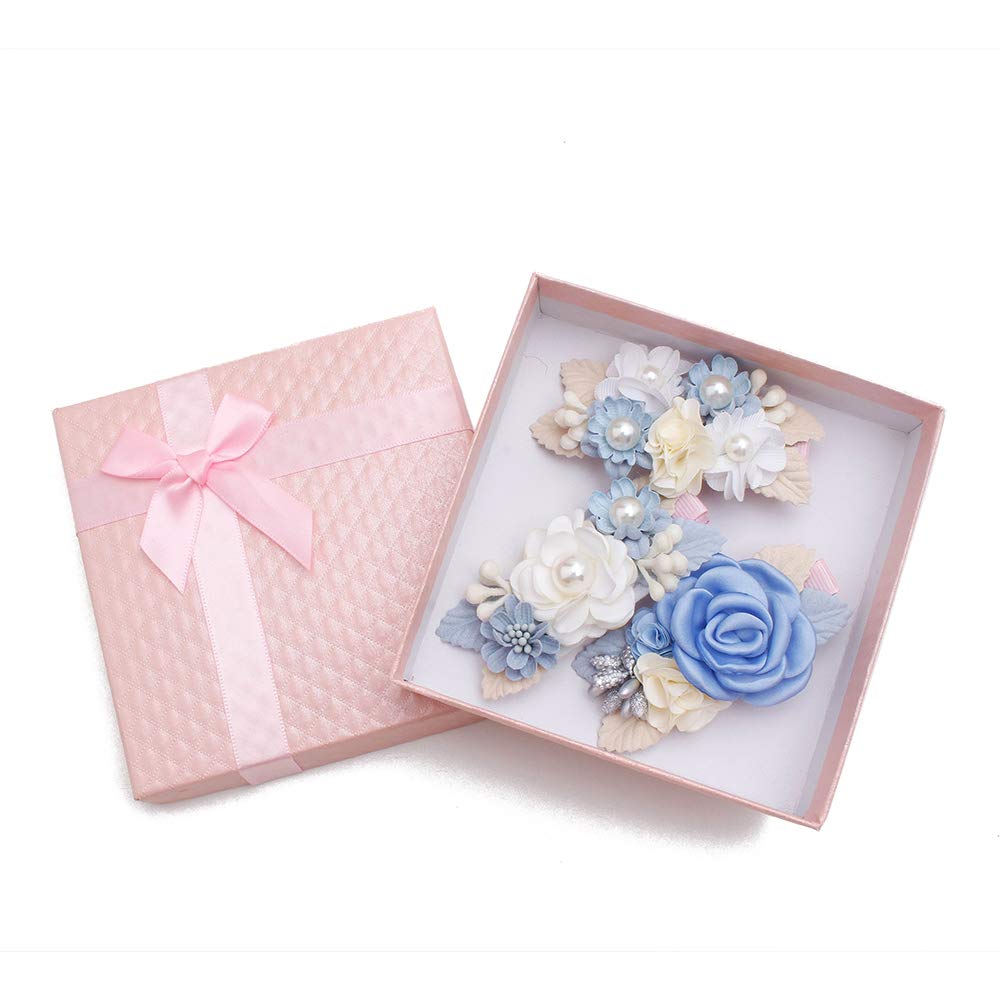 Cherrboll ivory rose clip complements newborn outfits.
