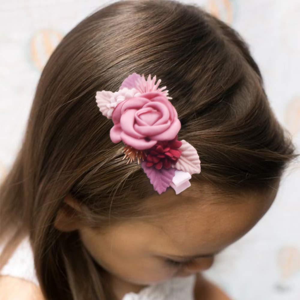 Cherrboll flower hair clip worn by toddlers for playful outfits.