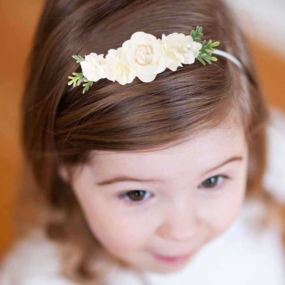 Cherrboll newborn to toddler headbands displayed in a family photo moment.