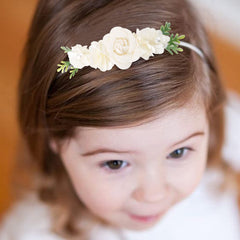 Cherrboll newborn to toddler headbands displayed in a family photo moment.