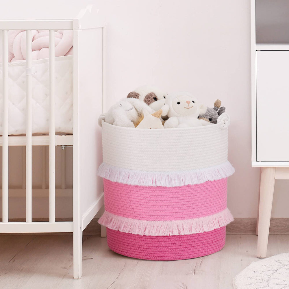 CherryNow nursery decor basket with pink tassels enhances girl's room ambience.
