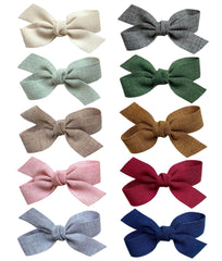 Cherssy forest tones baby bows clip securely for delicate infant hair.