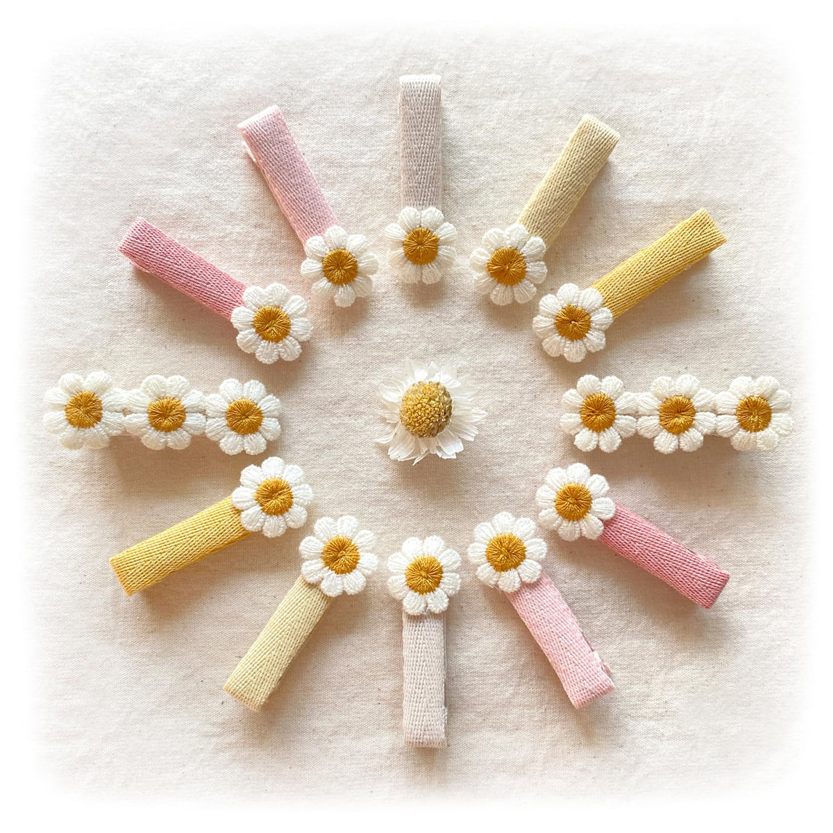 Cherssy daisy clip closeup showing embroidered flower and flat finish for gentle hair