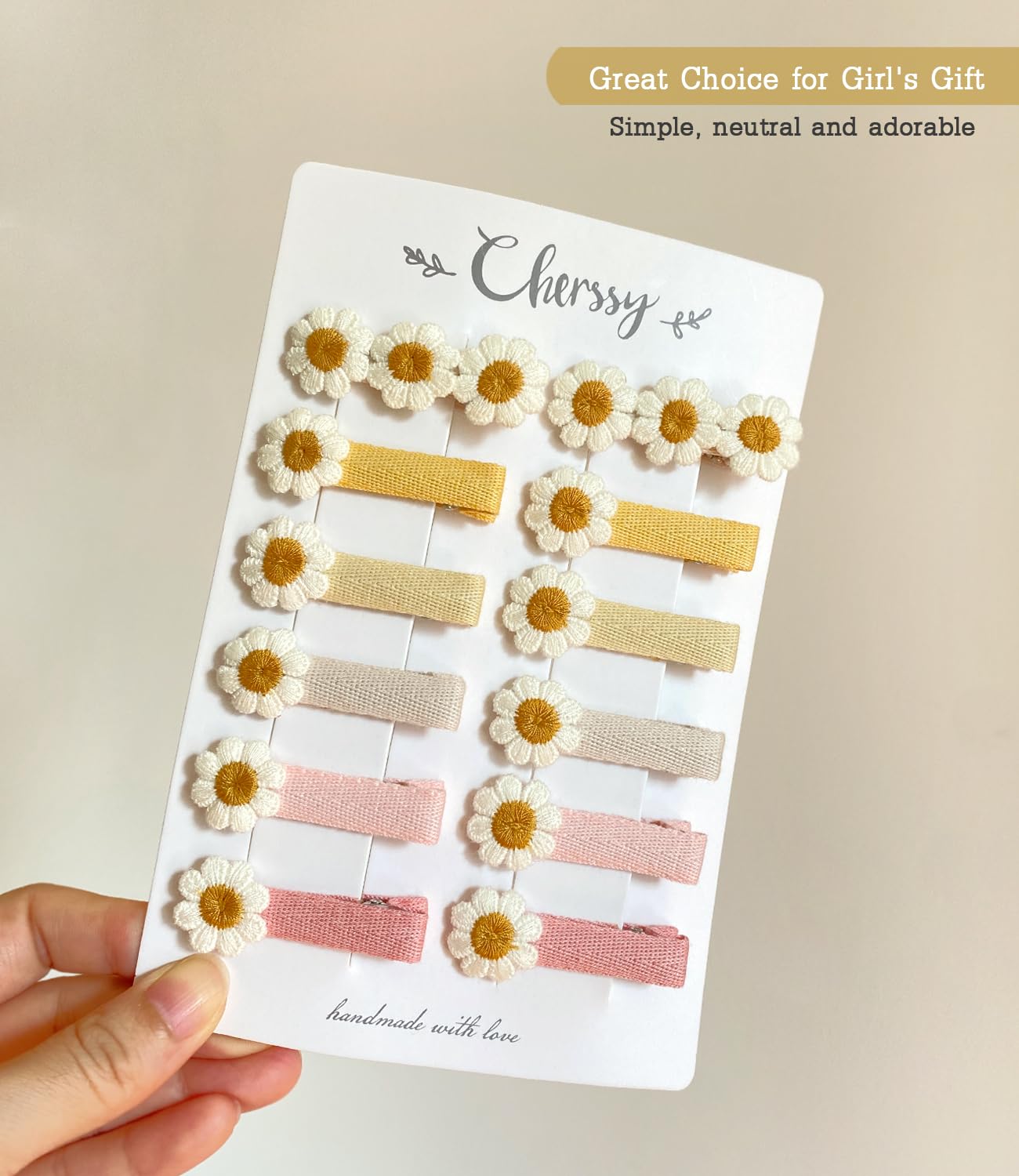 Cherssy daisy clip in infant hair shows secure fit for babies