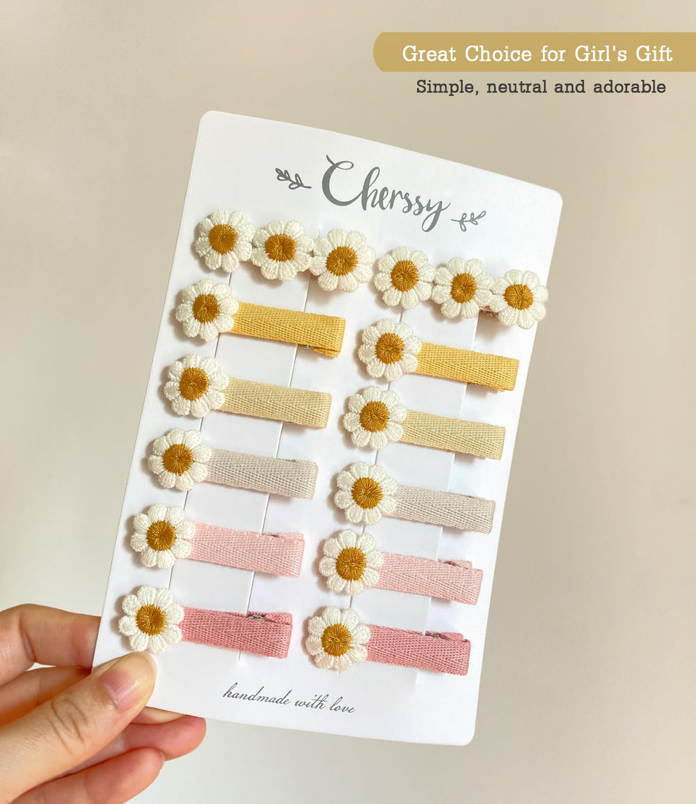 Cherssy daisy clip in infant hair shows secure fit for babies