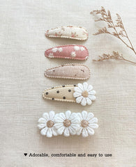 Cherssy neutral-tone clip complements many outfits.