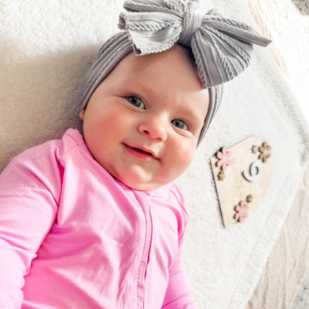 Chiduerm baby bows headband ivory pairs with many outfits and stays in place.