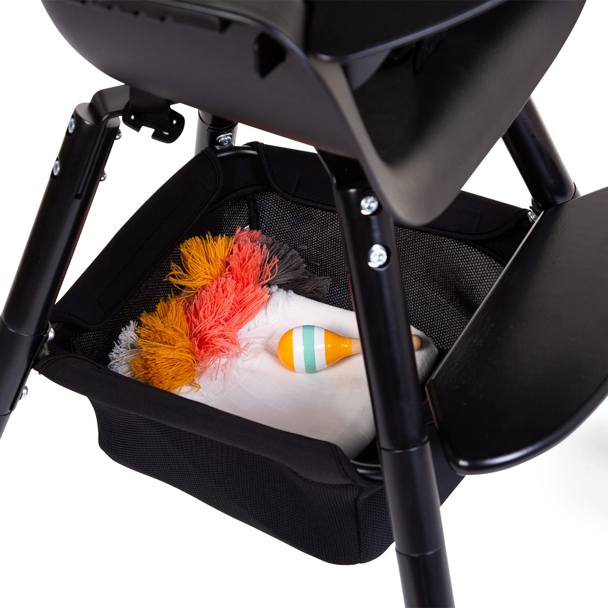 Close-up of the mesh basket showing breathable storage for meals and coloring books.