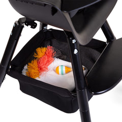 Close-up of the mesh basket showing breathable storage for meals and coloring books.