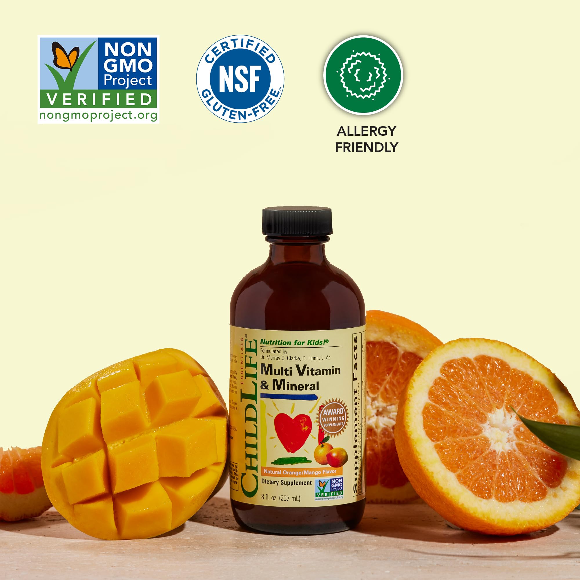 Happy child with CHILDLIFE ESSENTIALS orange mango flavored liquid smile.
