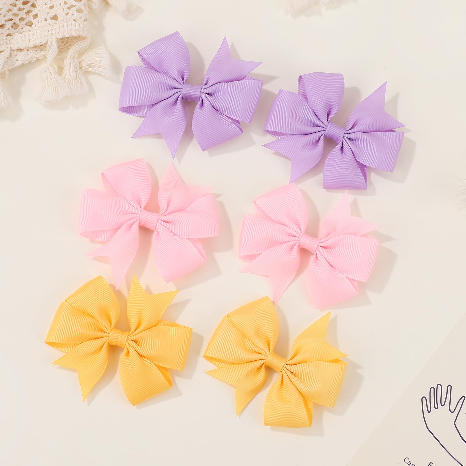 Choicbaby alligator-clip bows with secure hold.