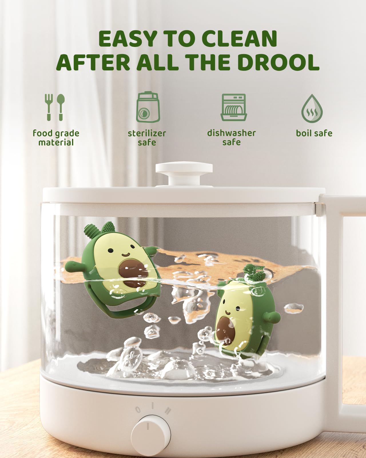 ChooKaChoo avocado teething mitten on baby with a smile