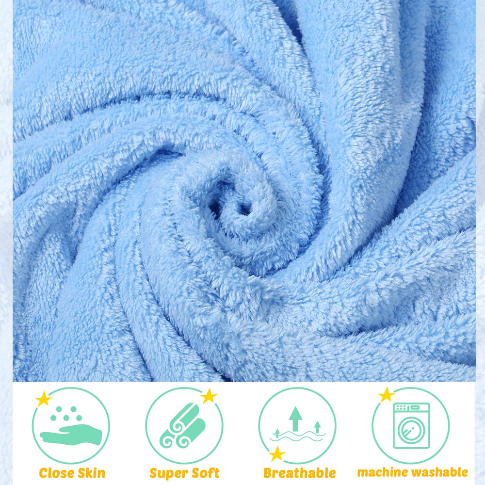 Baby wearing Chumia hooded towel, drying after bath.