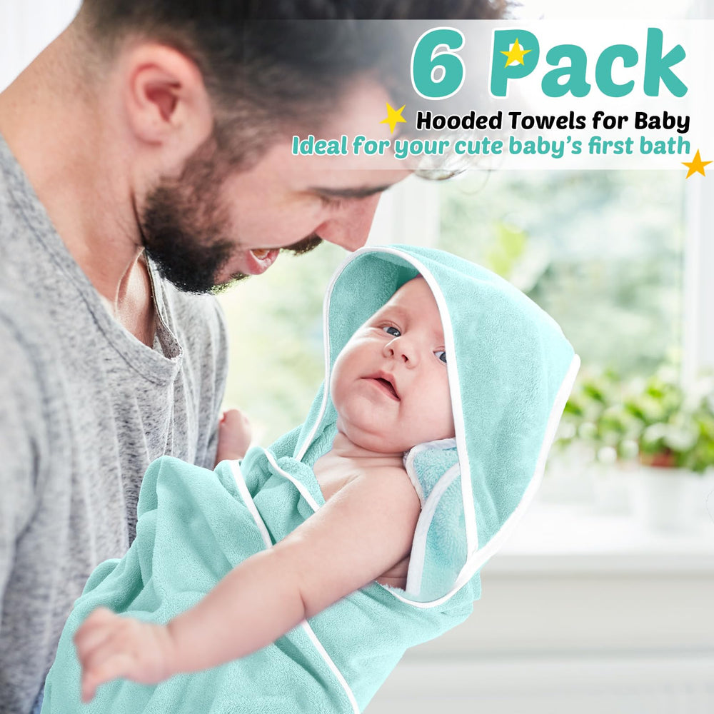 Chumia newborn gift towels in white and green ideal for unisex registries.
