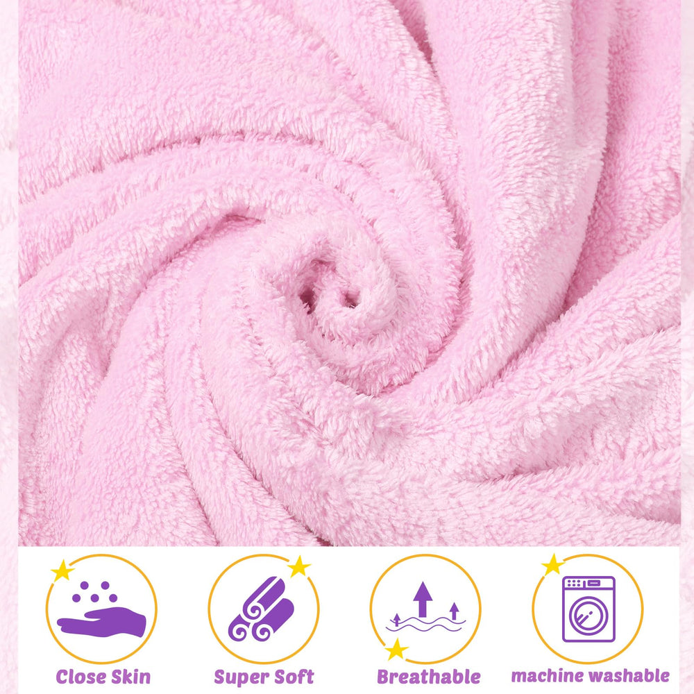 Chumia hooded towel wrapped around a newborn after bath for warmth.