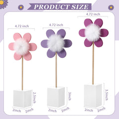 Chunful fluffy pom pom centers add playful detail to a daisy table centerpiece
