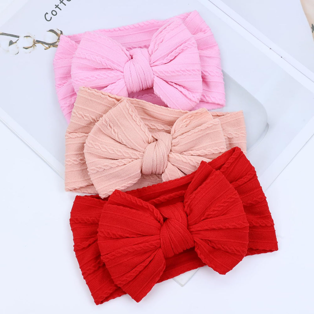 Cinaci headband closeup showing bow detail and soft fabric