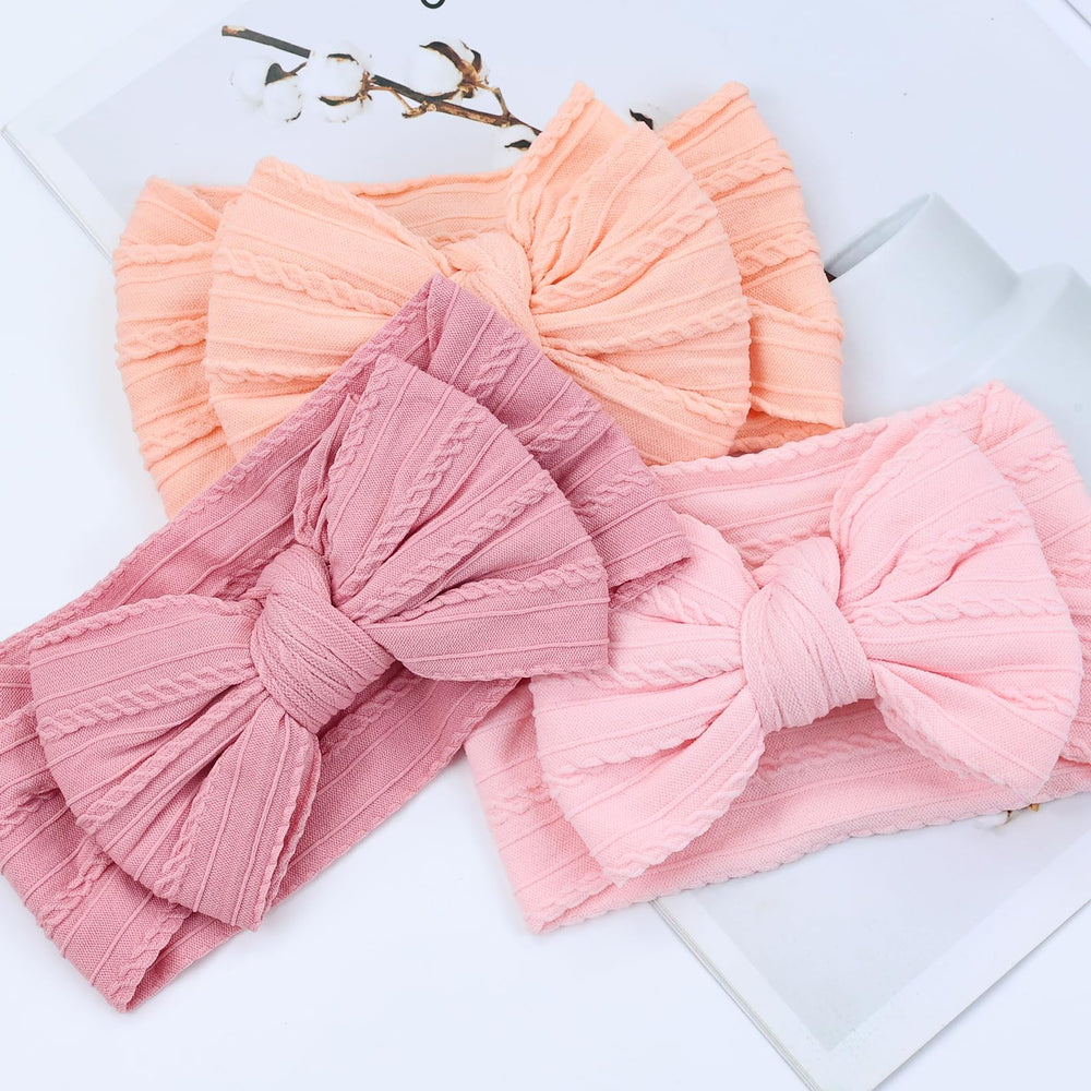 Cinaci stretchy headband demonstrates comfortable stretch for growing babies.