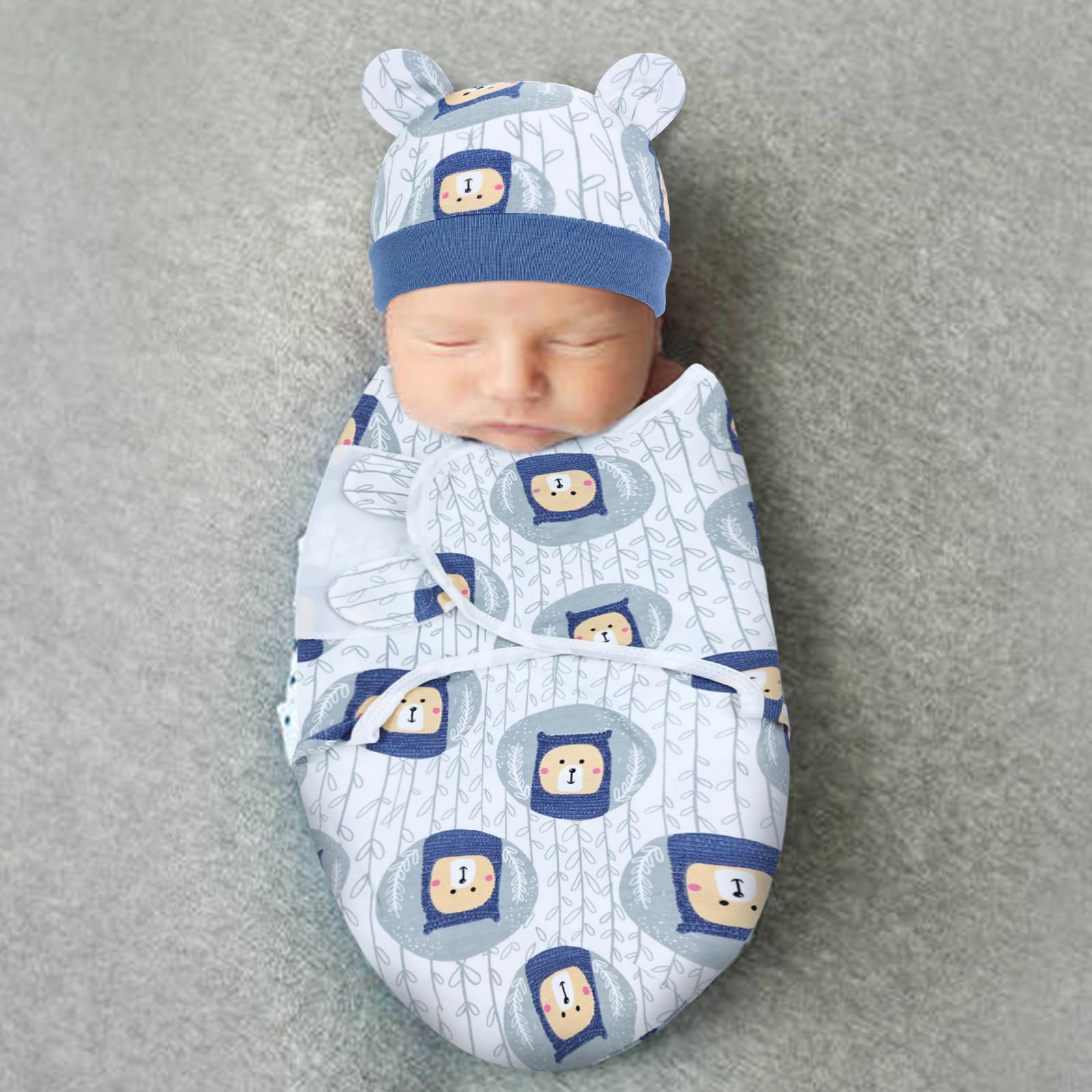 Cinaci newborn wearing swaddle and hat in crib for cozy sleep