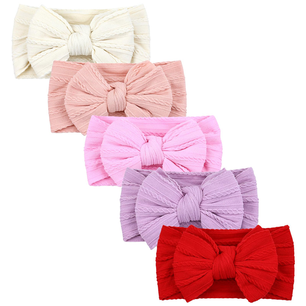 Cinaci ivory headbands with a soft, oversized bow for newborns and toddlers