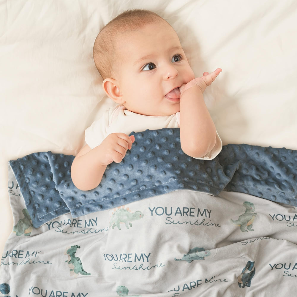 Civarua Kids 30x40 baby blanket shown wrapped around a baby.