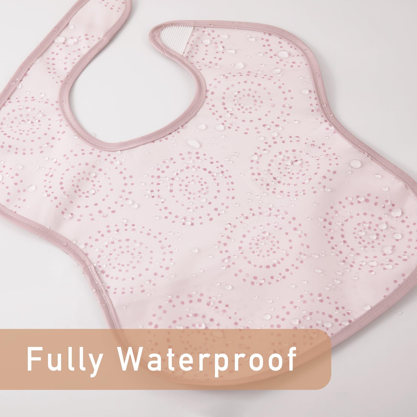 Civarua Kids pink floral bib in action catching drips during feeding