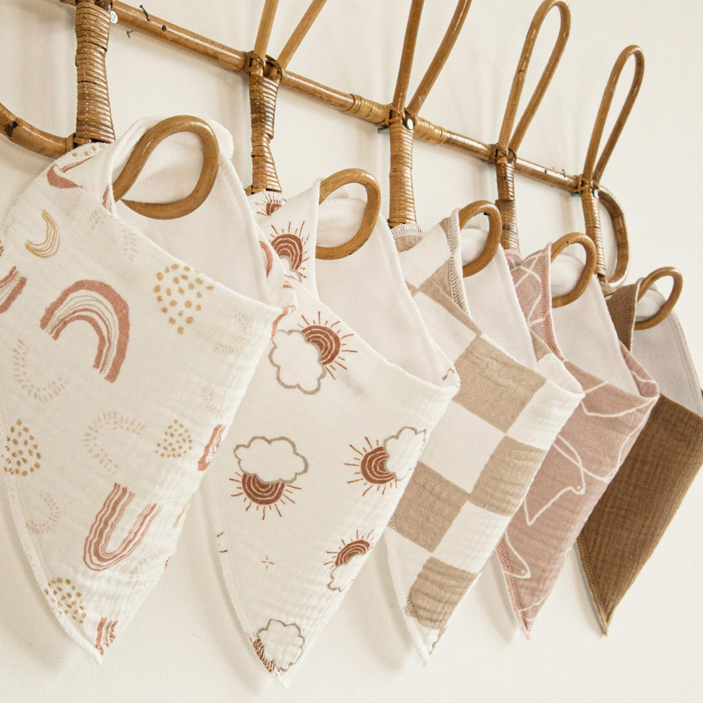 Machine-washable care label on Civarua Kids muslin bibs in use