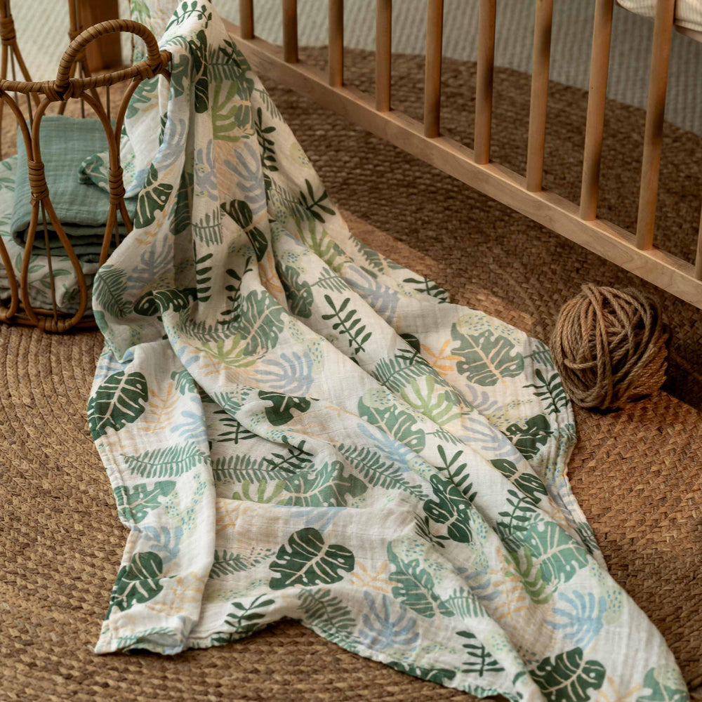 Nursing cover setup using a CIVARUA KIDS muslin swaddle blanket.