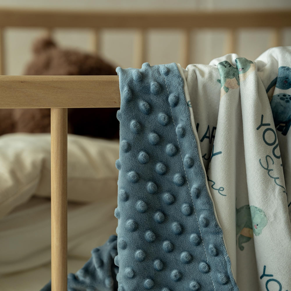Civarua Kids nursery dinosaur print on crib, adding playful style.