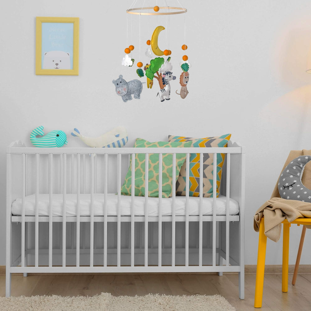Hanging over crib setup showing how the mobile enhances nursery ambiance.