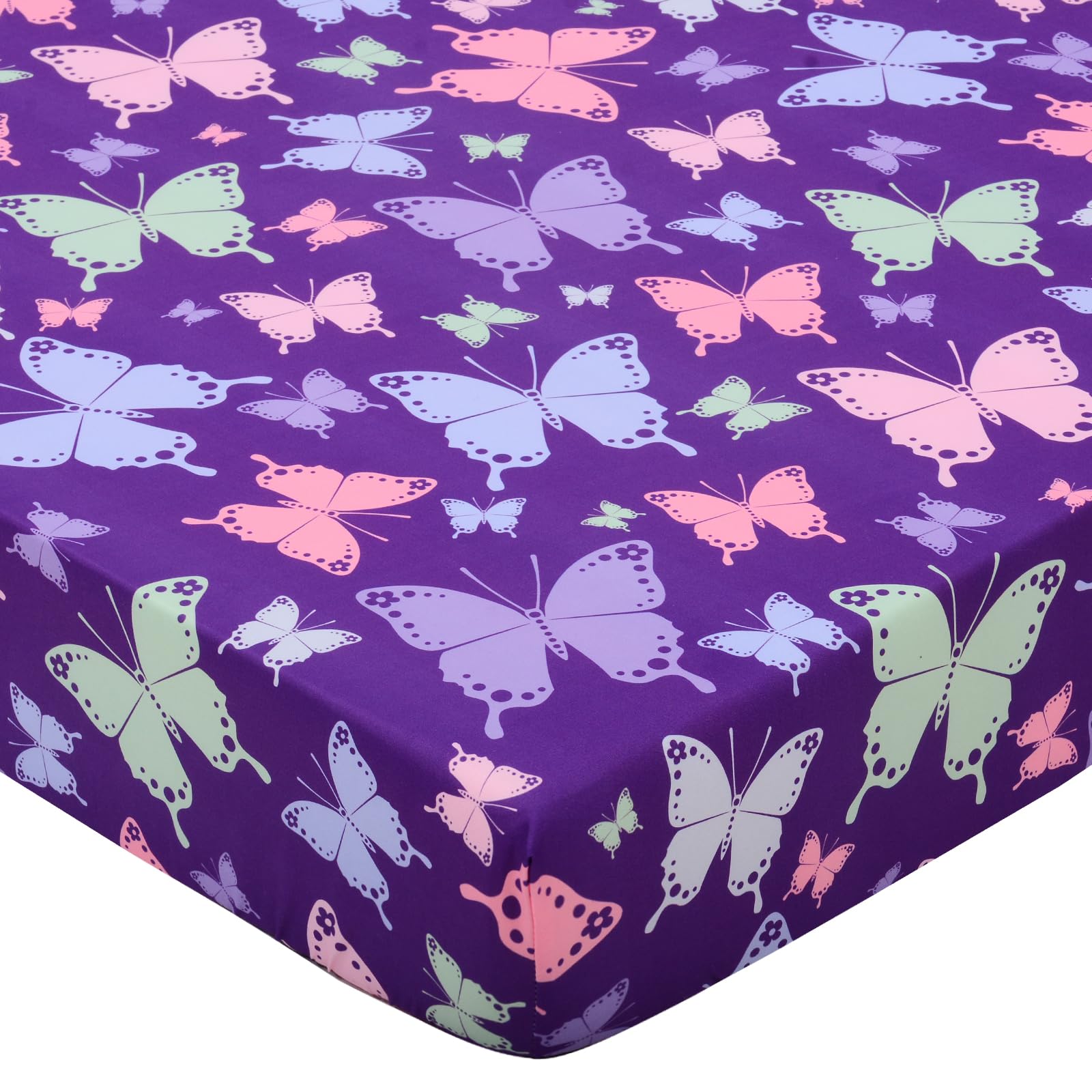 Cloele butterfly-printed crib sheet adds playful color to a gentle girls' nursery.