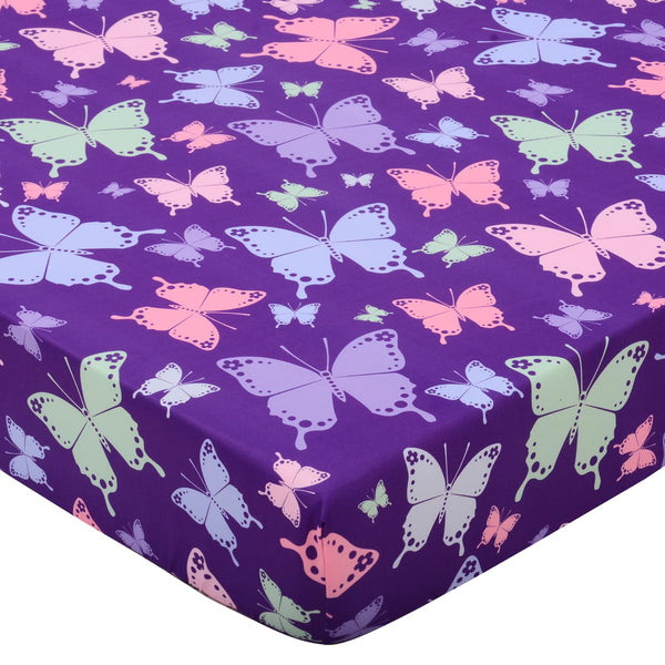 Cloele butterfly-printed crib sheet adds playful color to a gentle girls' nursery.