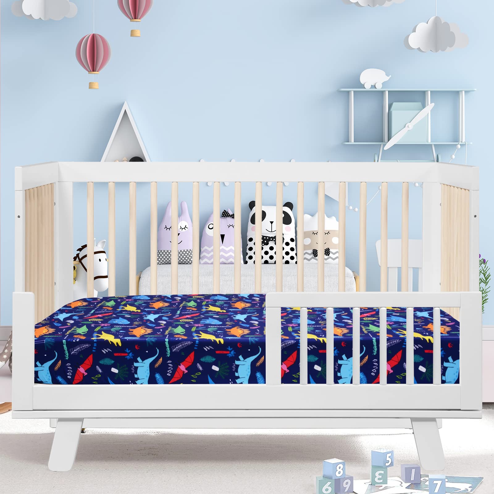 Cloele blue dinosaur nursery sheet ideal for toddler bed transition.